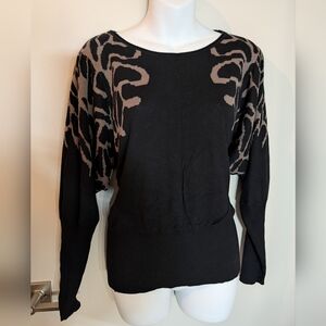 Chic Black Sweater with Flounced Patterned Shoulders